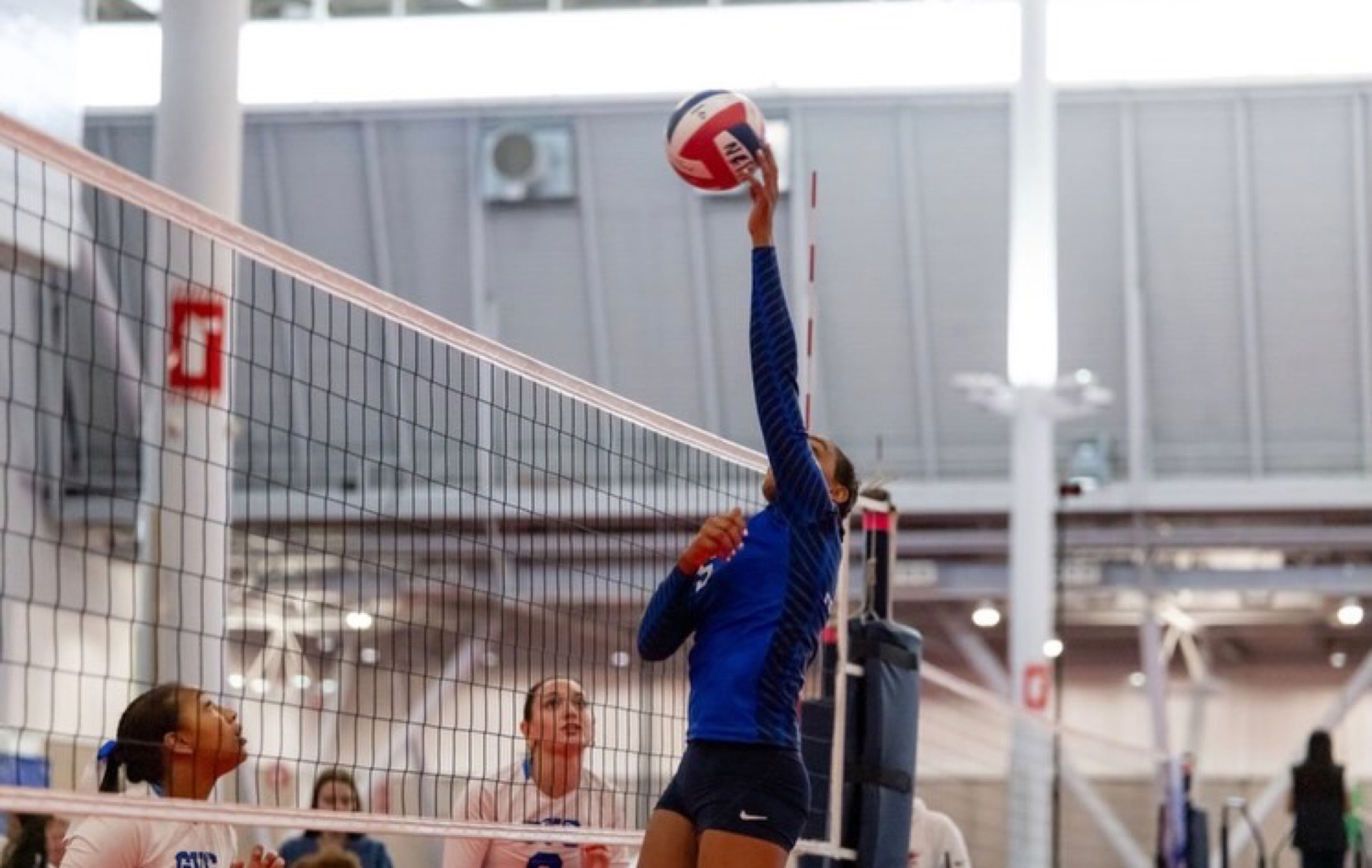 Lia Black competing in volleyball